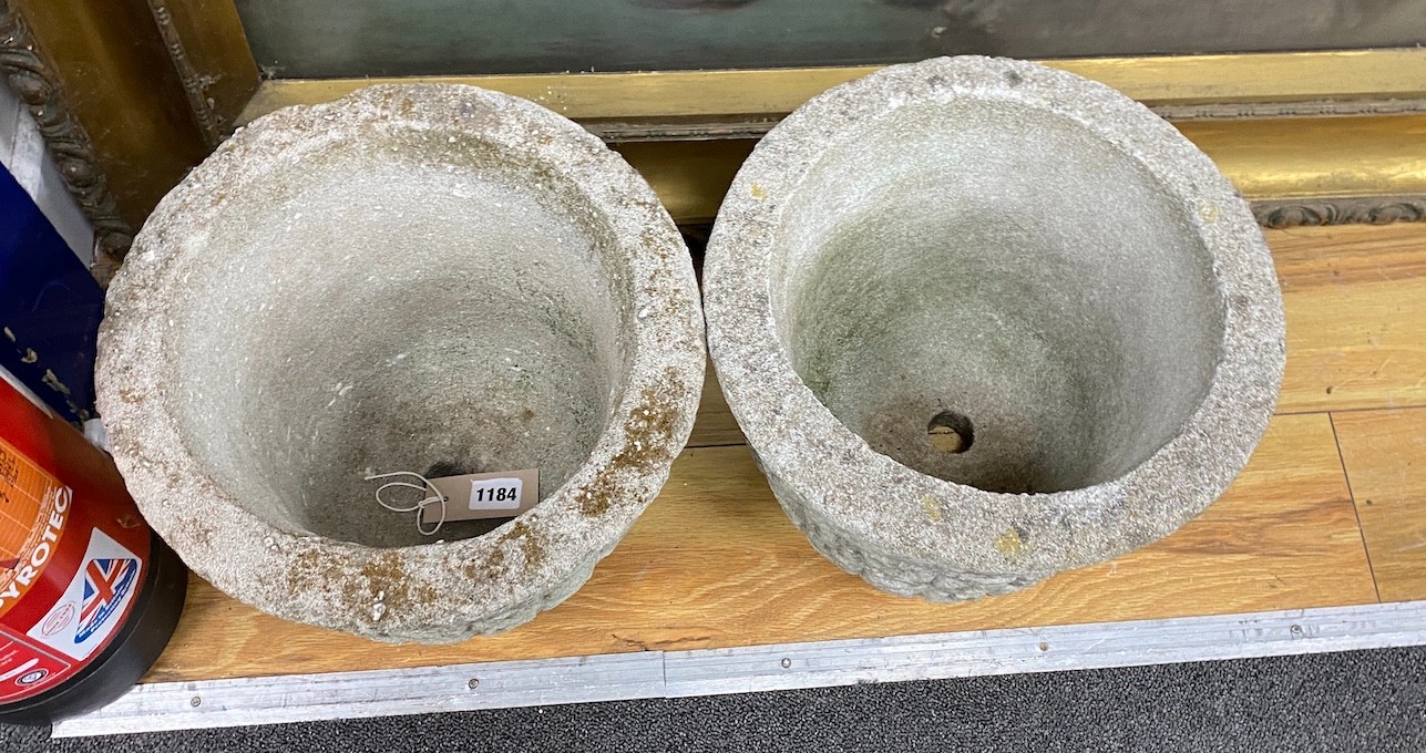 A pair of circular reconstituted stone garden planters, diameter 30cm, height 24cm
